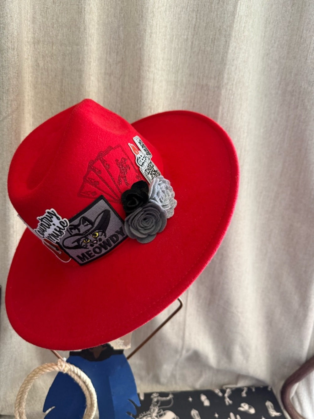 red cowboy hat meowdy patched up branded and flowers nfr Las Vegas cowgirl